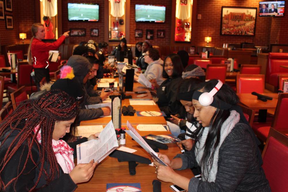 Students having dinner at a local restaurant in St. Louis